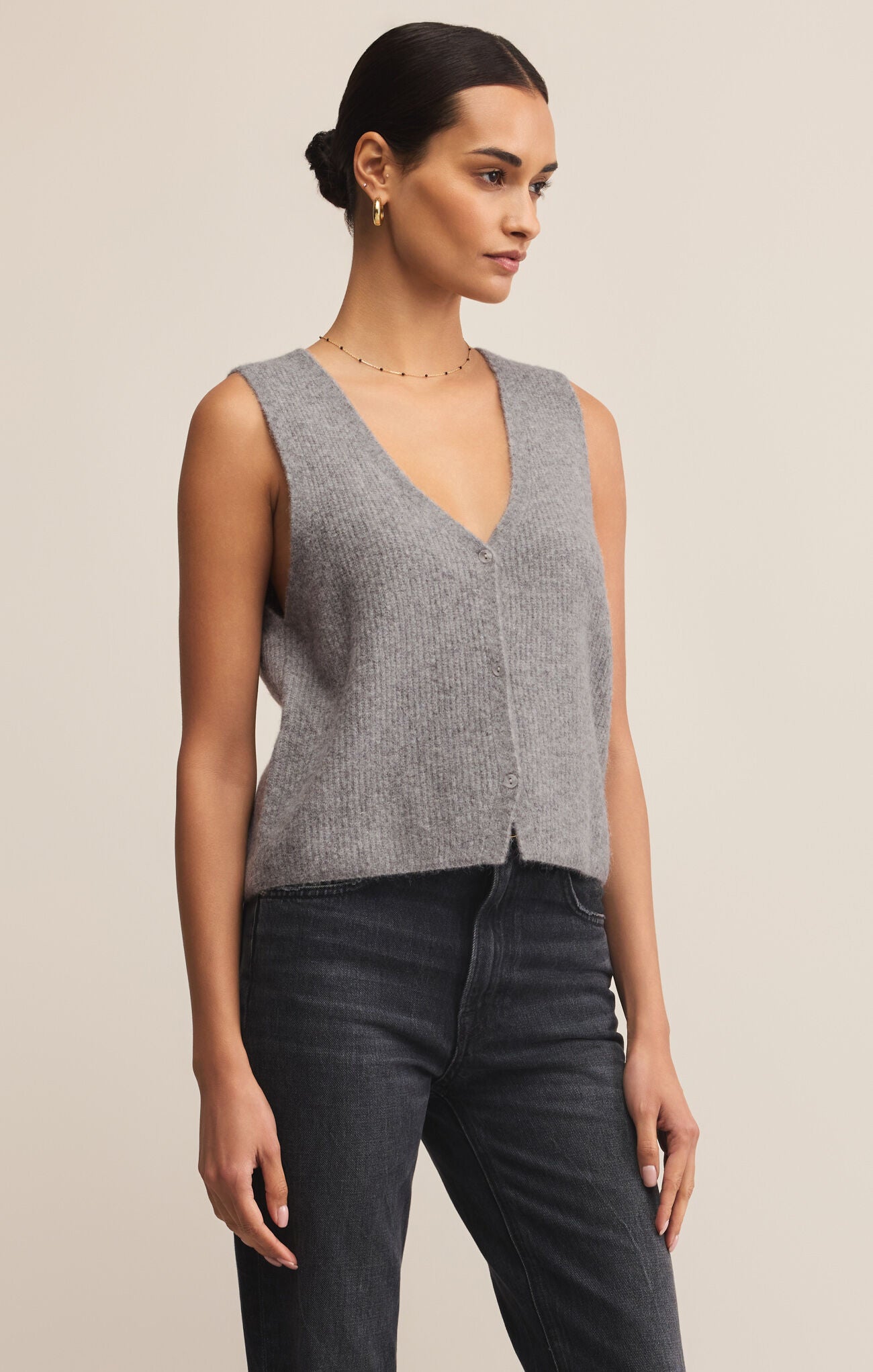 The Bryce Sweater Vest is a v-neck, medium weight vest that buttons up the front.