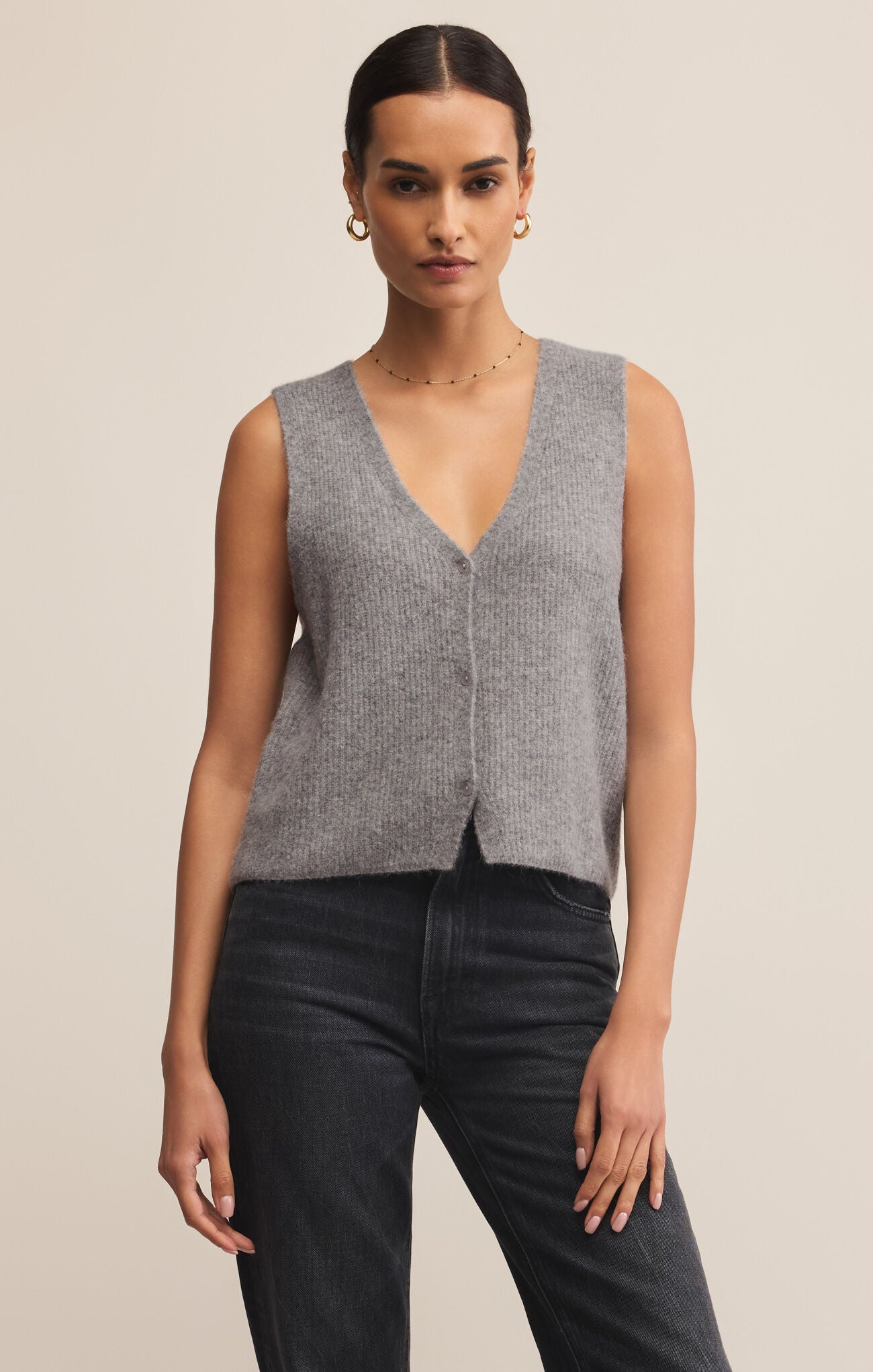 The Bryce Sweater Vest is a v-neck, medium weight vest that buttons up the front.