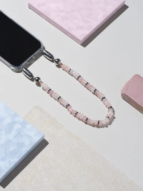 Linked Gemstone Wristlet - High polished rose quartz chips strung together with silver hematite disks.