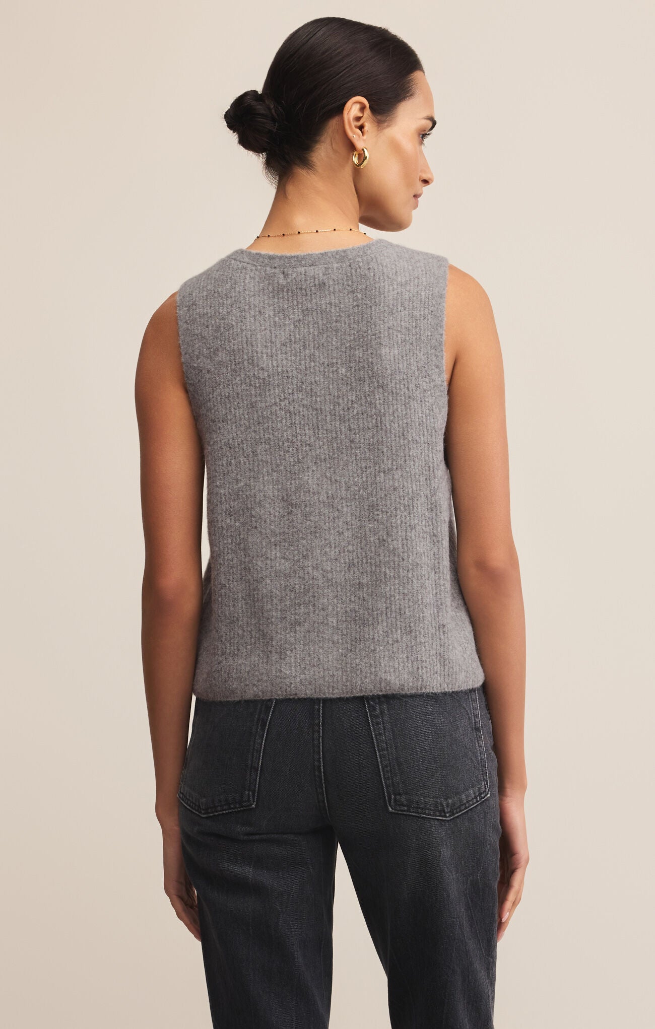 The Bryce Sweater Vest is a v-neck, medium weight vest that buttons up the front.